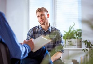 Man talking with psychiatrist